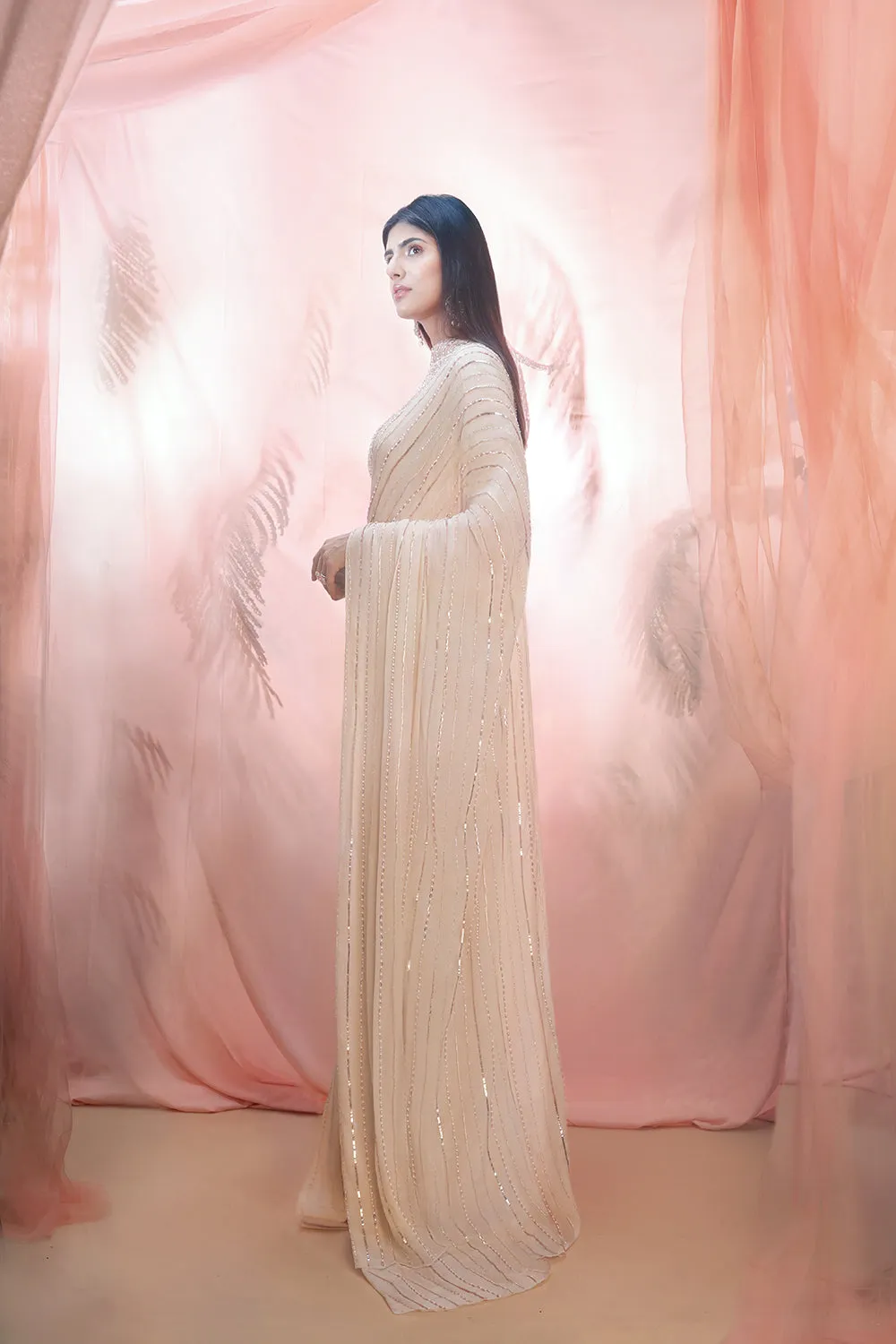 Golden Saree With An Elbow Sleeve Blouse